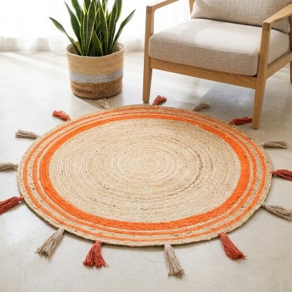 Orange trim braided round jute rug with tassels